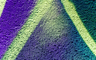 Colorful beautiful background of urban spray drawing graffiti on city wall. Bright vivid pattern of  modern art for wallpaper and design.