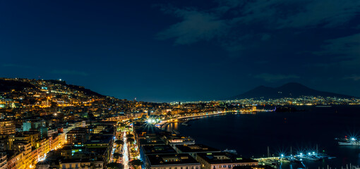 beautiful night panorama of Naples city with nice lights streets flashlights and buildings and...