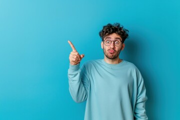 Fototapeta premium Photo of a man pointing finger face surprised person.