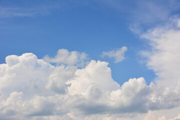 a cumulus cloud in the blue sky copy space