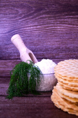 salted waffles with silja and dill on a wooden table. beer snack