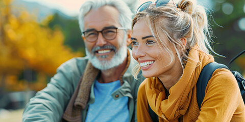 Fototapeta premium Smiling senior couple together in leisure at the park, radiating romantic happiness amidst nature's beauty