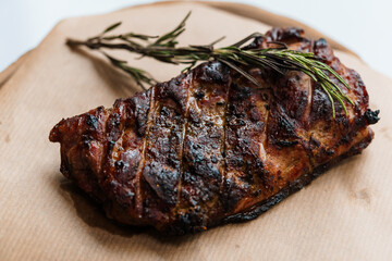 Pork steak with sauce on a wooden board