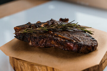 Pork steak with sauce on a wooden board