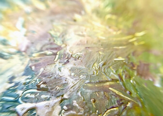 artist's palette with oil paints multi-colored background