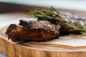 Pork steak with sauce on a wooden board