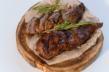 Pork steak with sauce on a wooden board