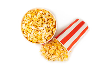 Popcorn box. Red and white striped buckets of popcorn isolated on white background. Cinema and entertainment concept. Movie night with popcorn. Cheesy popcorn. Delicious appetizer, snack. 