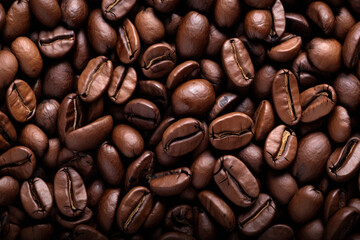 Fototapeta premium Processed collage of dark brown coffee beans texture. Background for banner, backdrop or texture