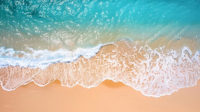 Aerial view of tide blue sea water and sandy beach
