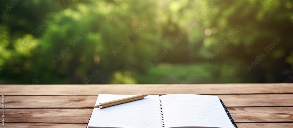 Leinwandbilder pen and open notepad with blank page on wood table. copy space available