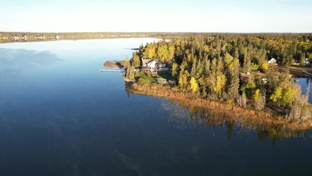 Aerial Drone Video of Emma Lake, SK in Autumn - Vibrant Fall Colors, Scenic Lake Views, and Forests