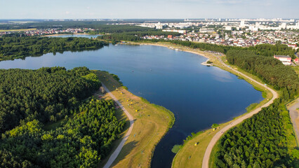 Scenic Aerial View of Lake Surrounded by Fields, Forests, and Buildings in Minsk, Belarus, Europe
