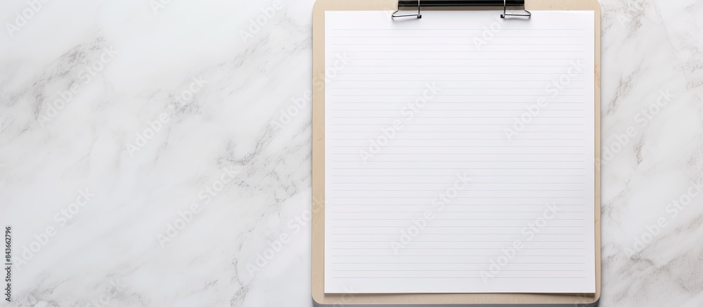 Aufkleber A top down view of a to do list on a blank page with a light gray stone background providing copy space for images