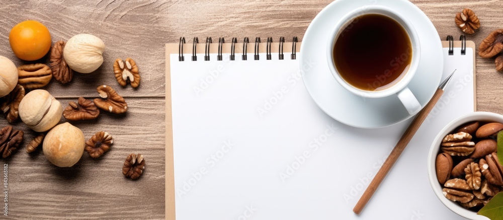 Poster notepad pencil cup of coffee apple and walnuts on napkins template for text top view. copy space ava