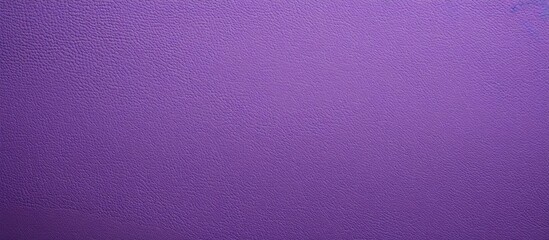 Close up image of a textured purple paper background with space for copying