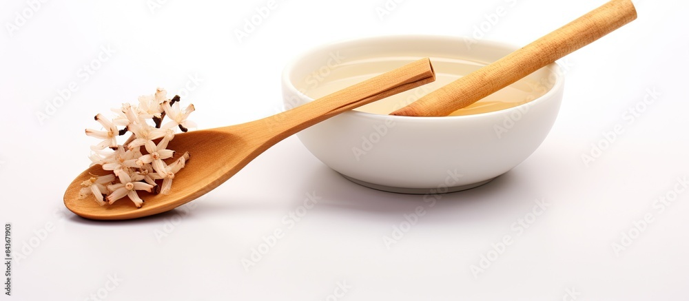 Poster copy space image of vanilla sticks and a spoon on a white background emitting a delightful aroma