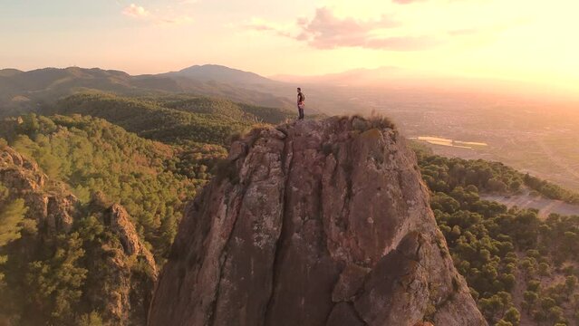 Sportsman rock climbing aerial view of sportsman rapelling mountain in La Panocha, el Valle Murcia, Spain woman rapel down a mountain climbing a big rock
