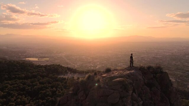 Sportsman rock climbing aerial view of sportsman rapelling mountain in La Panocha, el Valle Murcia, Spain woman rapel down a mountain climbing a big rock