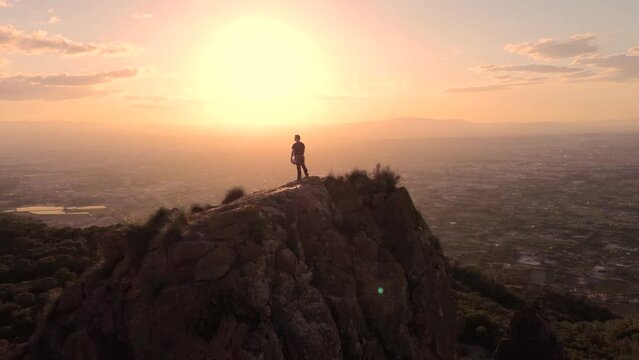 Sportsman rock climbing aerial view of sportsman rapelling mountain in La Panocha, el Valle Murcia, Spain woman rapel down a mountain climbing a big rock