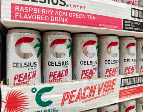 Celsius Peach Vibe energy drinks displayed on supermarket shelf