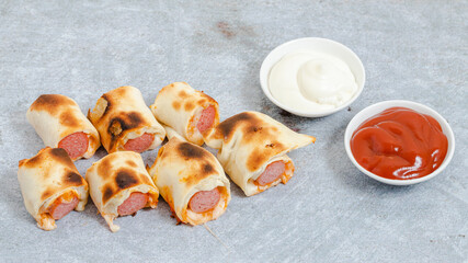 Chicken roll sliced isolated on table