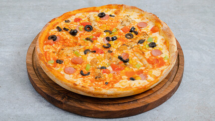 Delicious pizza isolated on wooden board