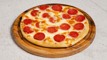 Delicious pizza isolated on wooden board