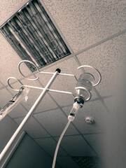 Hospital room and medical supplies. liquid for intravenous administration. A saline solution is drip-fed into the patient to the patient.