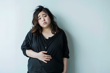 痩せたいのにダイエットに失敗してまた太ったことに悩む肥満女性
