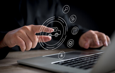 A businessman interacts with a virtual car service interface on a touchscreen, representing automotive services and management.	