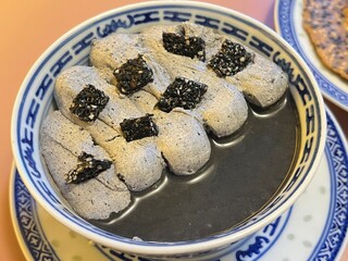 Creamy black sesame milk tea pudding with sesame cracker and sesame and kinako mochi