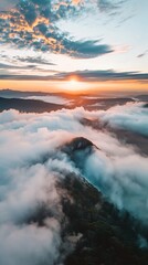 Obraz premium Stunning Aerial View of Dramatic Morning Fog around Head Mountain during Sunrise