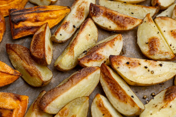 Crispy oven-baked potatoes. Delicious potatoes with for dinner just out of the oven