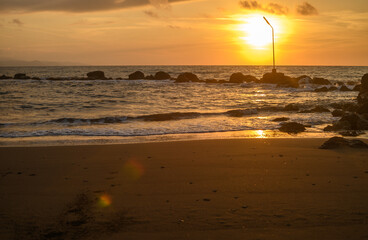 sun glare and radiance on water. sunset seascape with turquoise emerald coloured waves 1