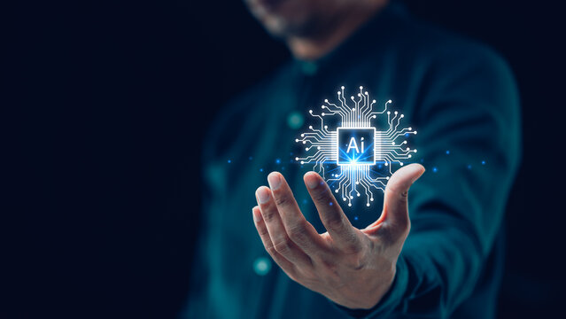Artificial intelligence and automated machine learning are featured in a blue digital user interface with a businessman’s hand in the background. Key concepts of industrial business.