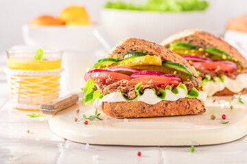 Healthy sandwich served with lemonade in the kitchen.