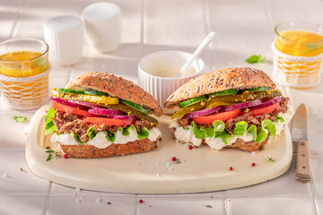 Tasty sandwich made of vegetables and beef.