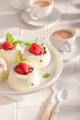 Homemade cheesecake monoportion served with coffee in summer.