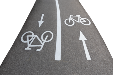 Bicycle lane signs with arrows in two directions on asphalt road, isolated image on transparent background, urban city concept, green city