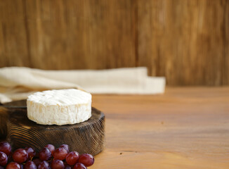 brie camembert cheese on a wooden board