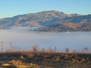 Mt Diablo and the surrounding foothills rise above the fog in San Ramon, California