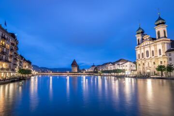 Obraz premium Night view of chapel bridge ,jesuitenkirche in old town are very famous and beautiful landscape in Luzern Switzerland 