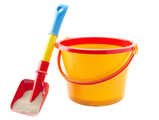 A red and yellow beach bucket and shovel filled with sand.