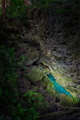 Sink Hole Illuminated at Night in Florida