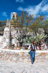 Latin woman exploring an old town in Mexico
