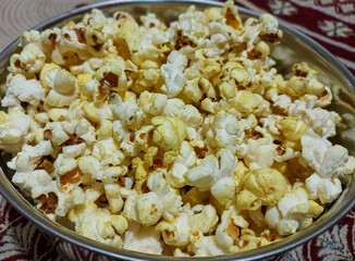 Popcorn in a big bowl, food photography, tasty snacks background 