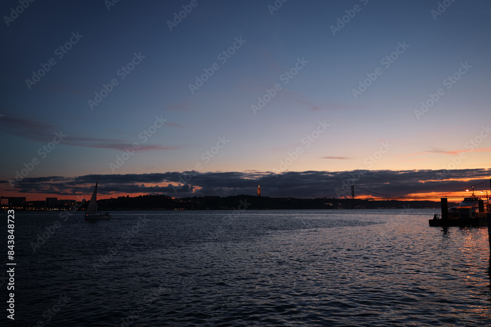 Wall mural Sunset on the river Tejo Tagus at Lisbon, Portugal.