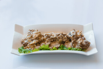 Stewed meat with vegetables and mushrooms