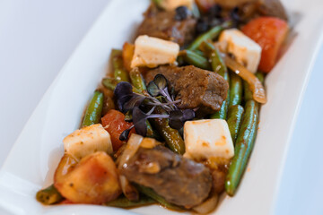 Stewed meat with vegetables and mushrooms